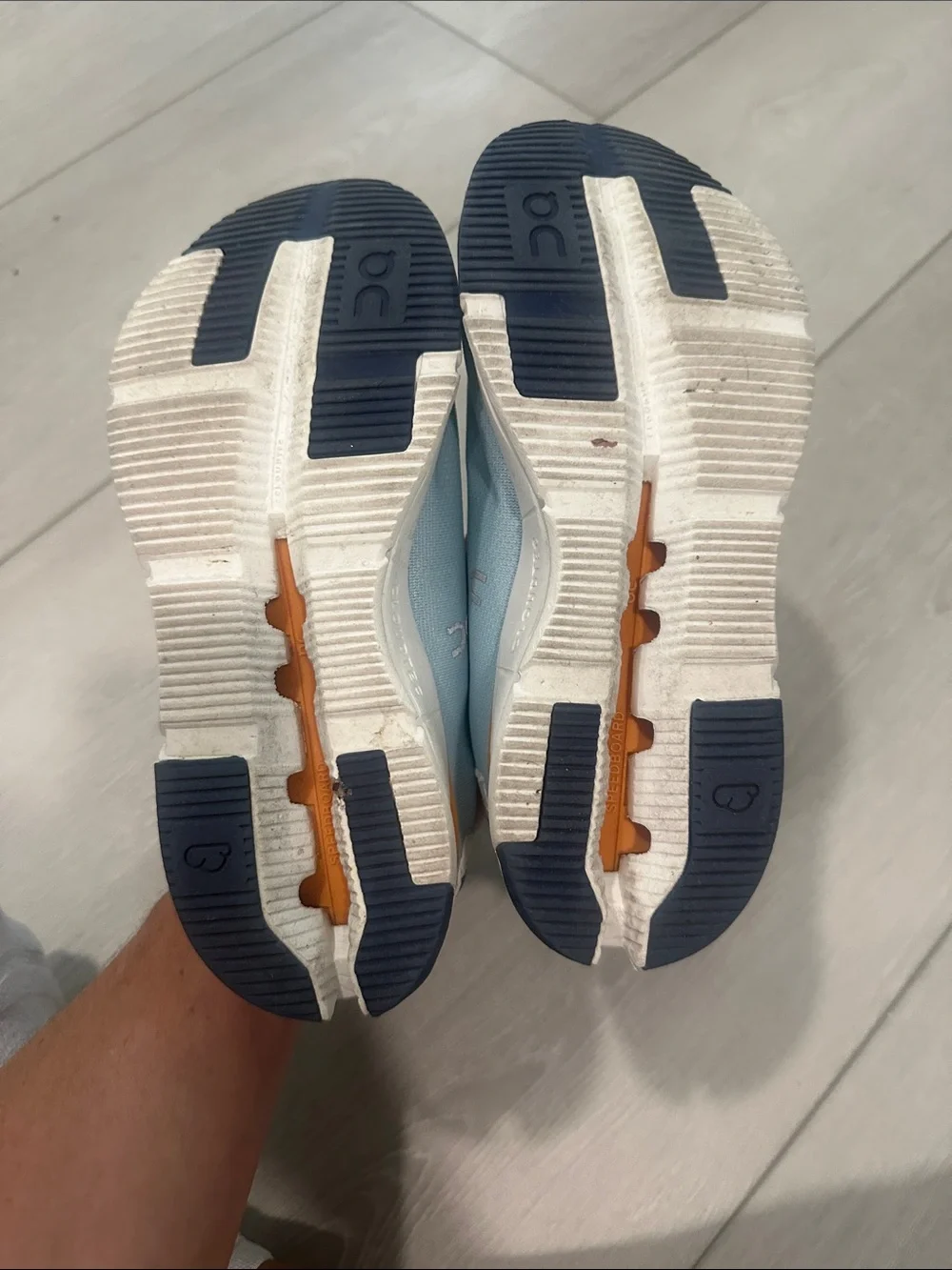 On Lightweight Women's Running Shoes in Light Blue and Orange